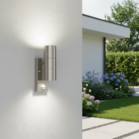 Modern outdoor wall light fixture on a house exterior with garden and trees in the background