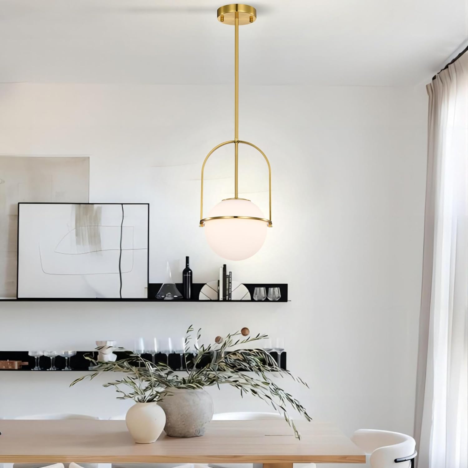 Modern pendant light in a stylish room with decor elements.