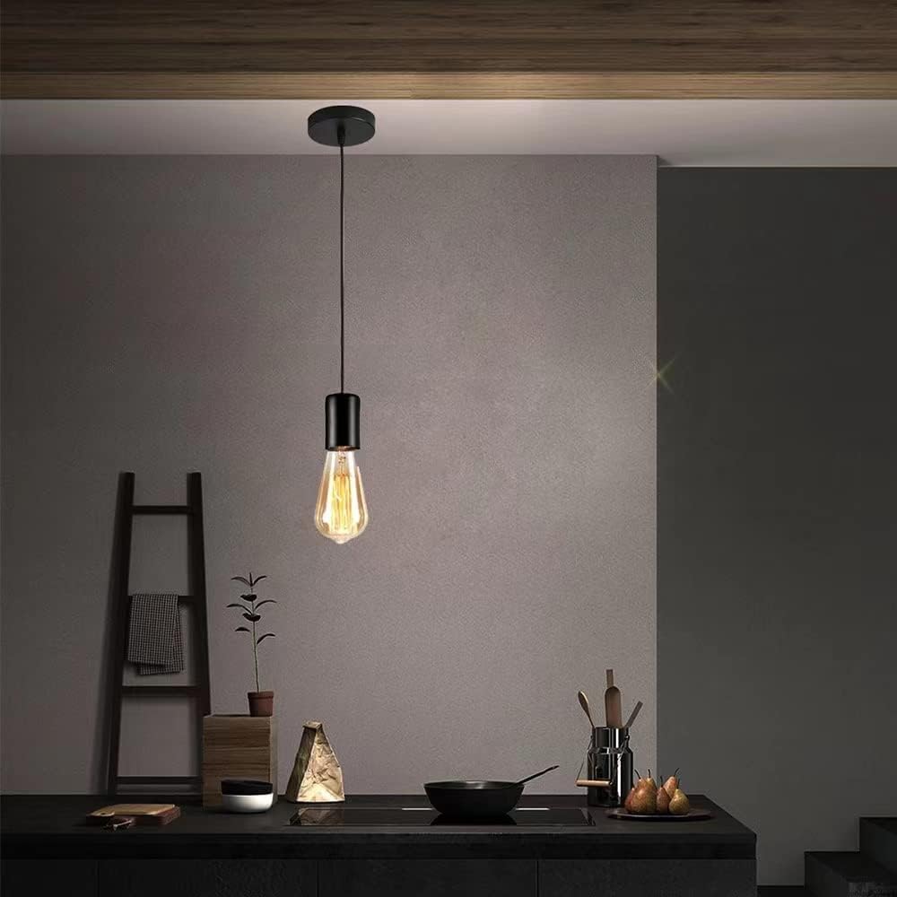 Modern pendant light fixture hanging above a kitchen counter with a neutral wall background.