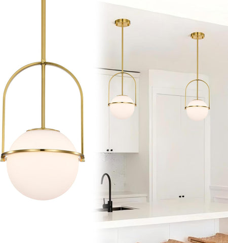 Modern pendant lights with gold fixtures and glass shades in a kitchen setting.