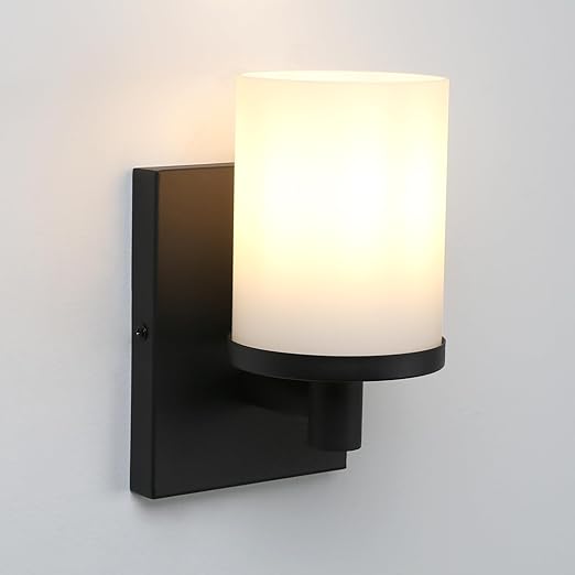 Modern wall-mounted light fixture with a white glass shade on a gray background