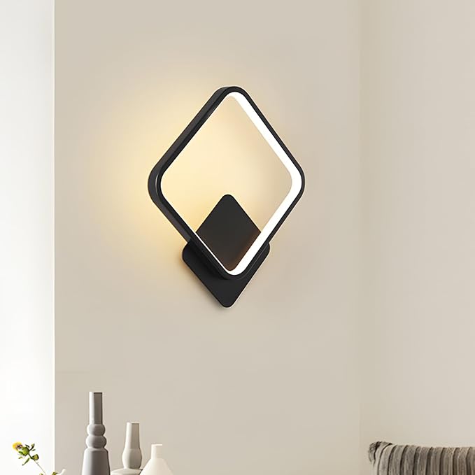 Modern wall lamp with diamond-shaped design on a neutral wall.