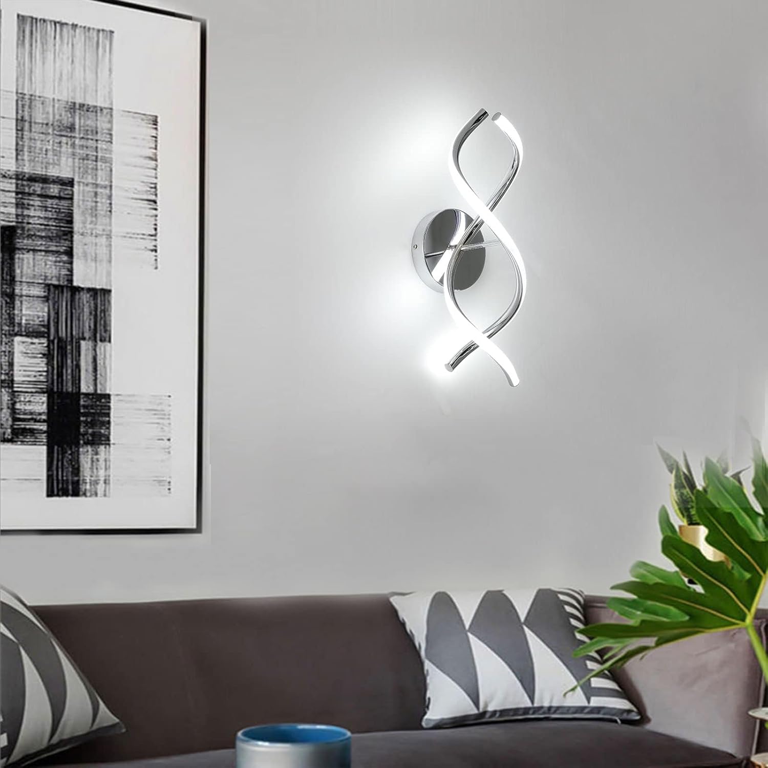 Modern wall light fixture on a gray wall above a sofa with decorative pillows.