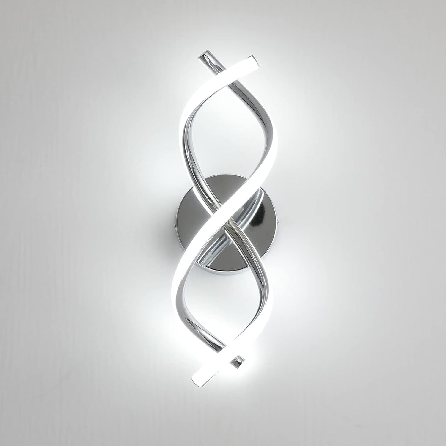 Modern wall light fixture with a spiral design on a white background