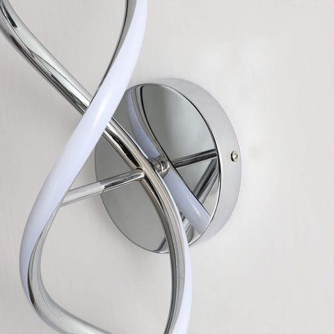 Modern wall light fixture with chrome finish and white accents on a neutral background