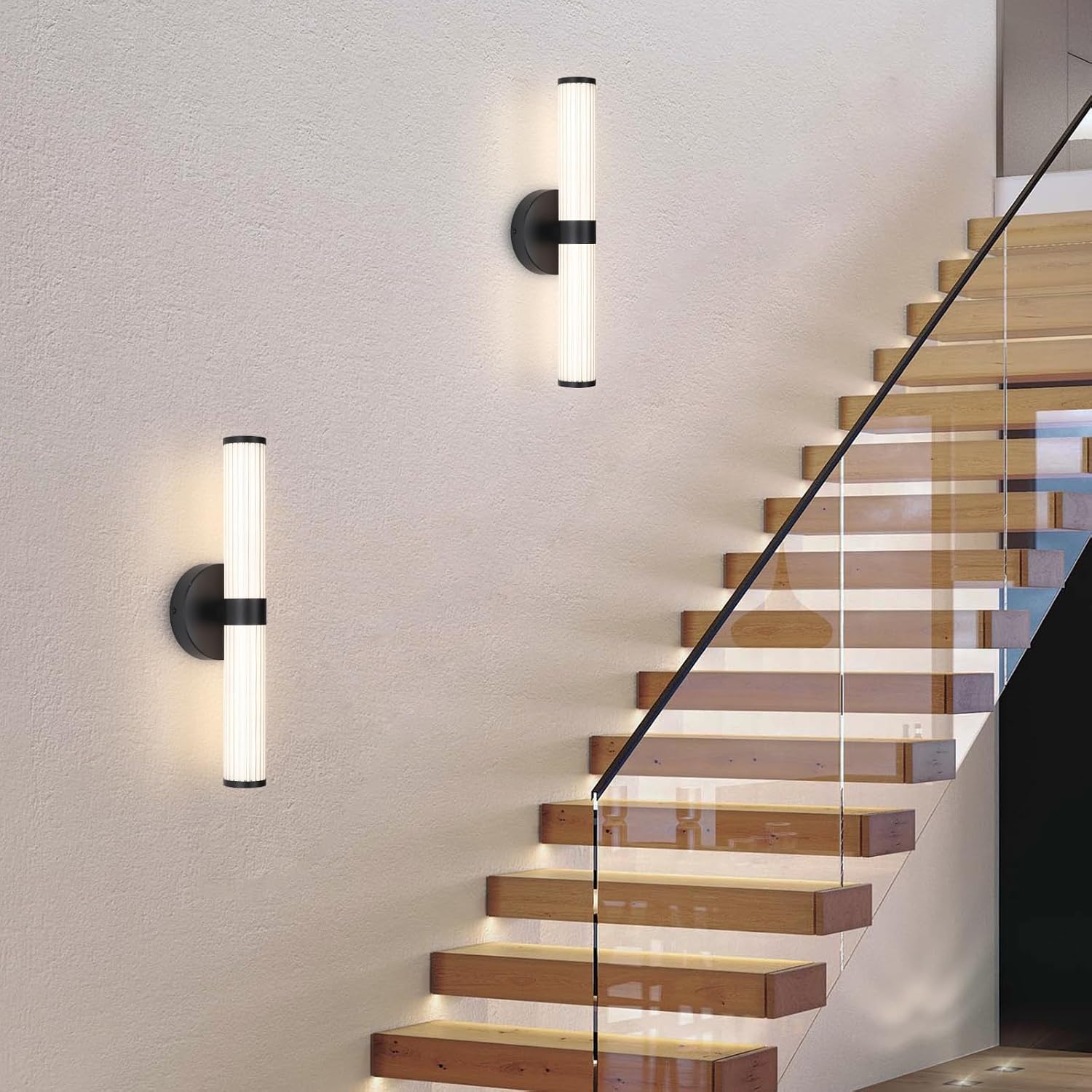 Modern wall lights on a staircase with glass railing