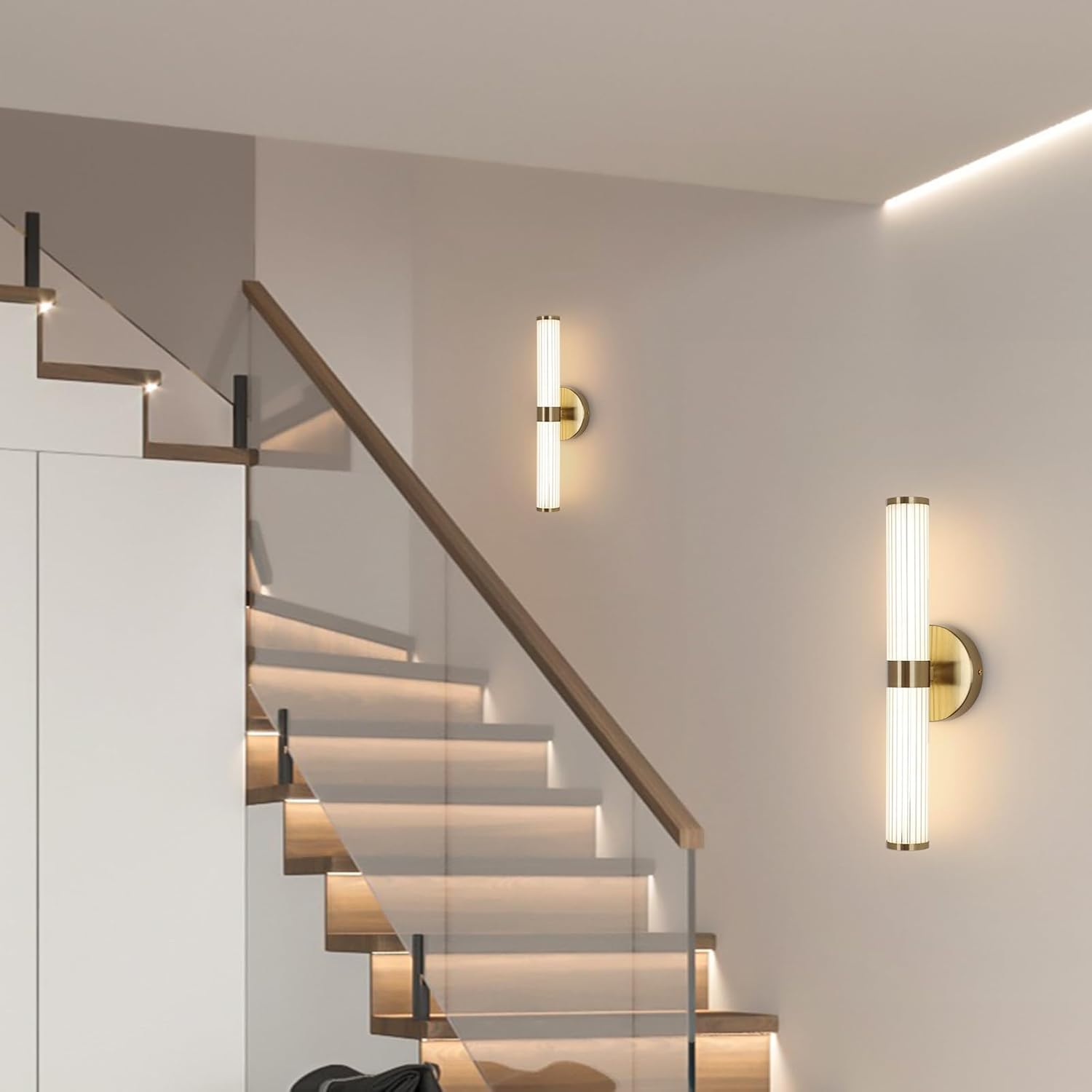Modern wall lights on a staircase with glass railings