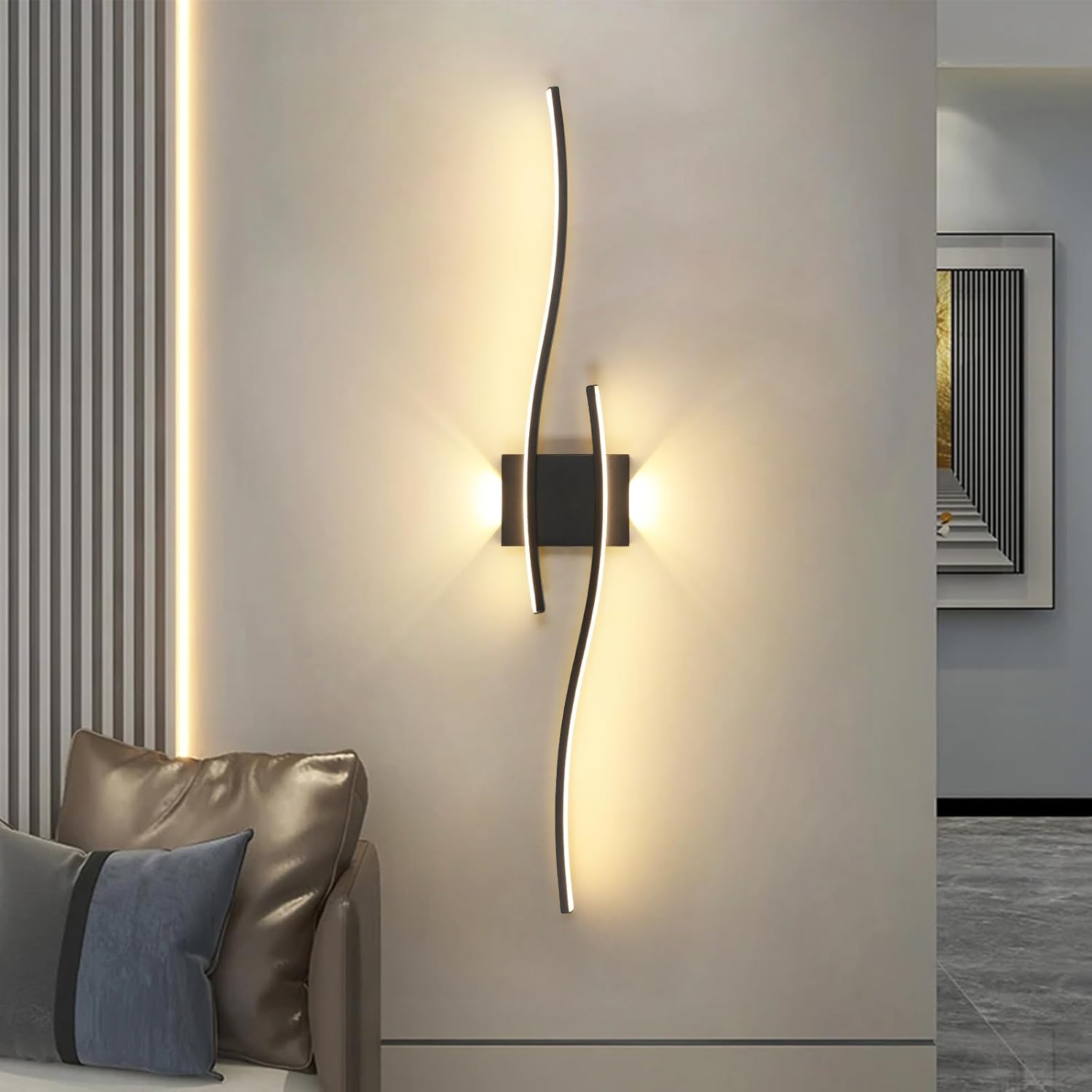 Modern wall sconce with a decorative light fixture on a neutral wall.