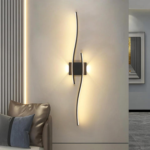 Modern wall sconce with a decorative light fixture on a neutral wall.