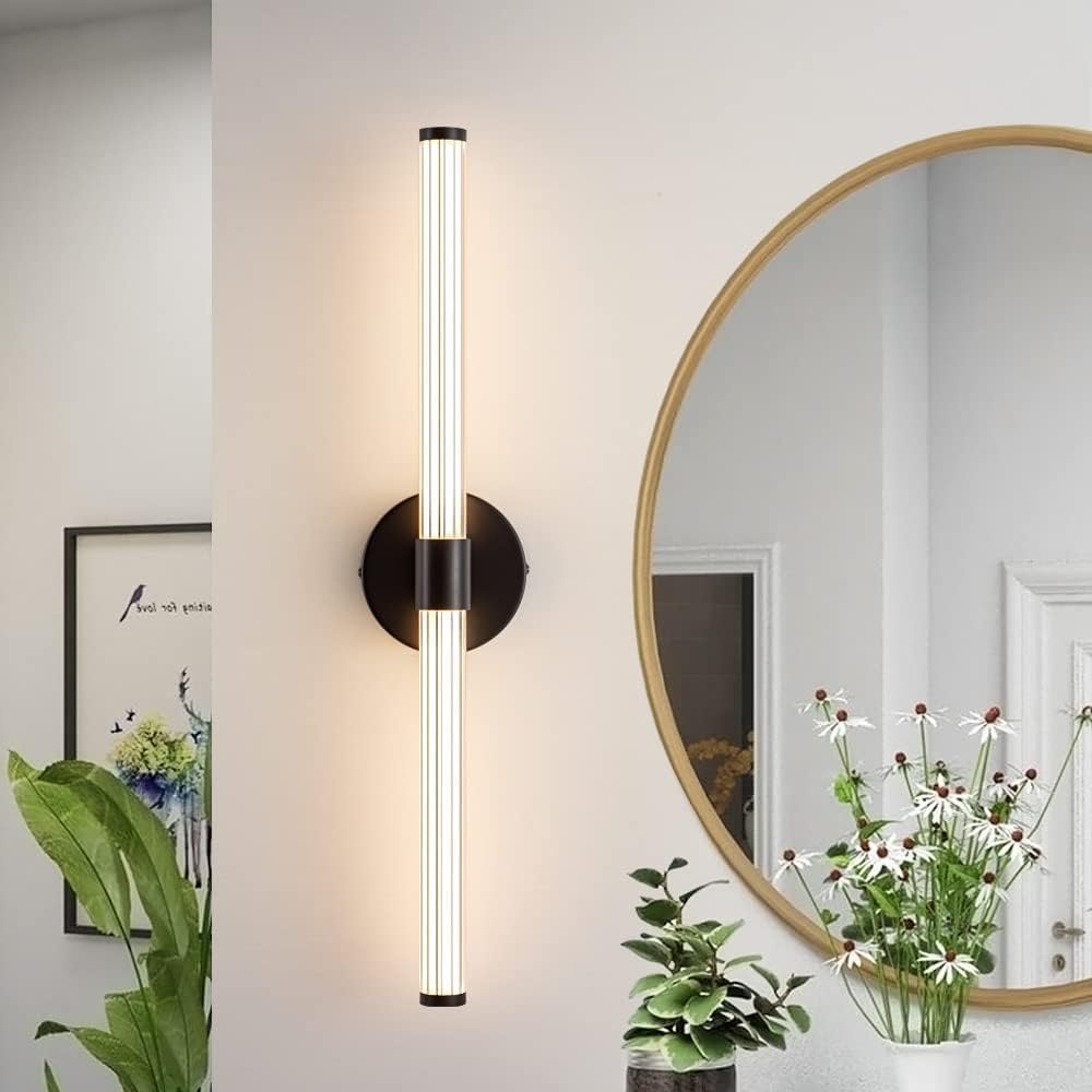 Modern wall sconce with a round mirror and plants in a room setting