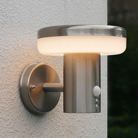 PIR sensor close-up on stainless steel body

