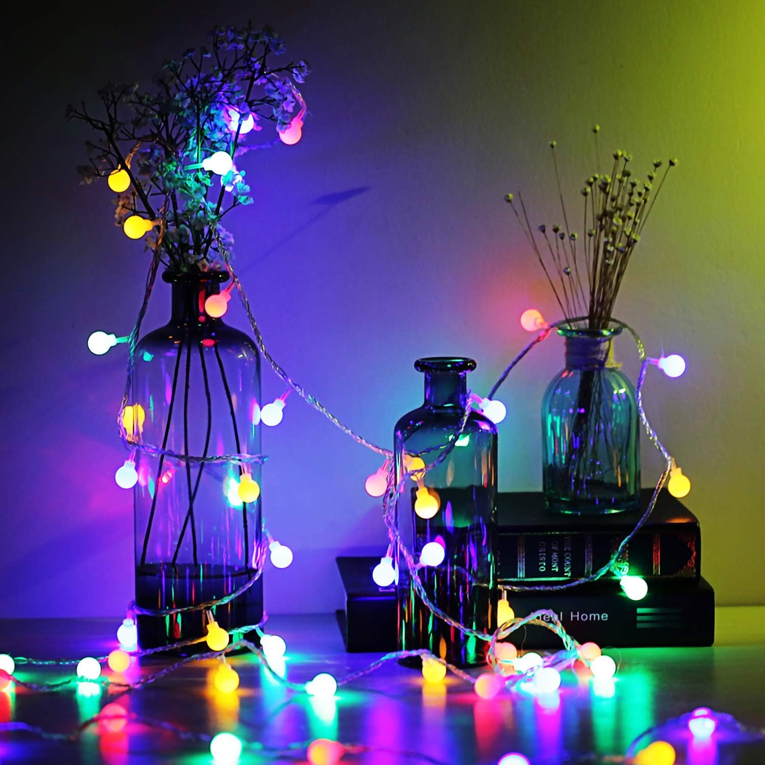 Glowing multicolour lights on a balcony railing


