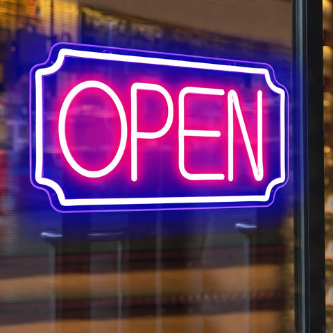 Neon 'OPEN' sign on a glass door