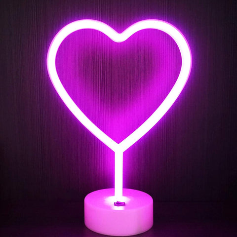 Neon heart-shaped light on a dark background