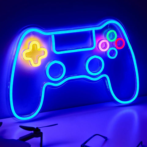 Neon light shaped like a gaming controller on a dark background