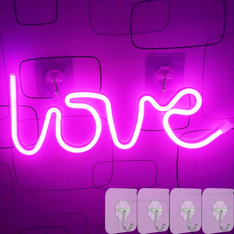 Neon sign spelling 'love' on a purple background with wall hooks below.