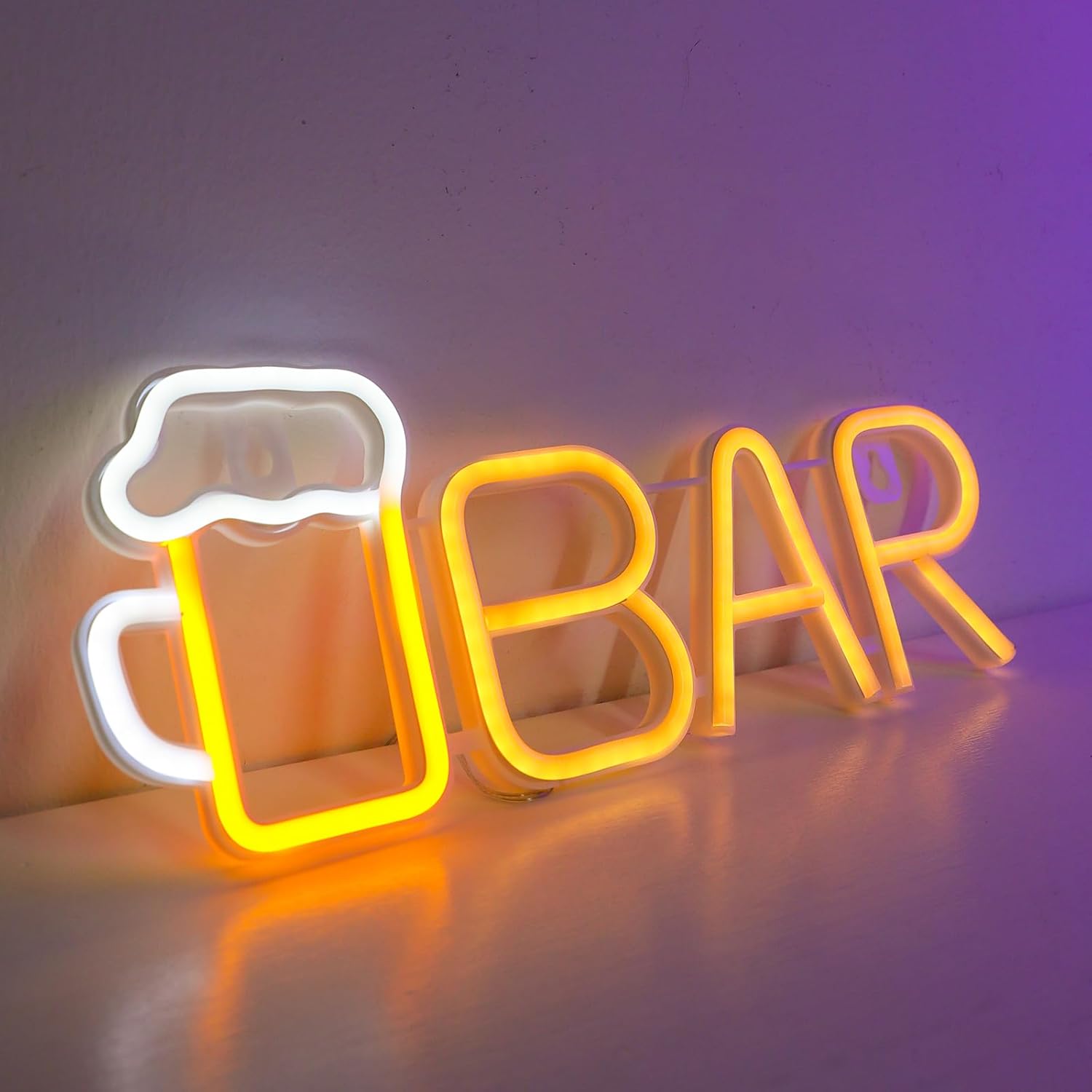 Neon sign with 'BAR' and a beer mug design on a reflective surface.