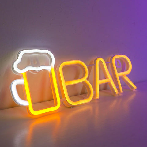 Neon sign with 'BAR' and a beer mug design on a reflective surface.