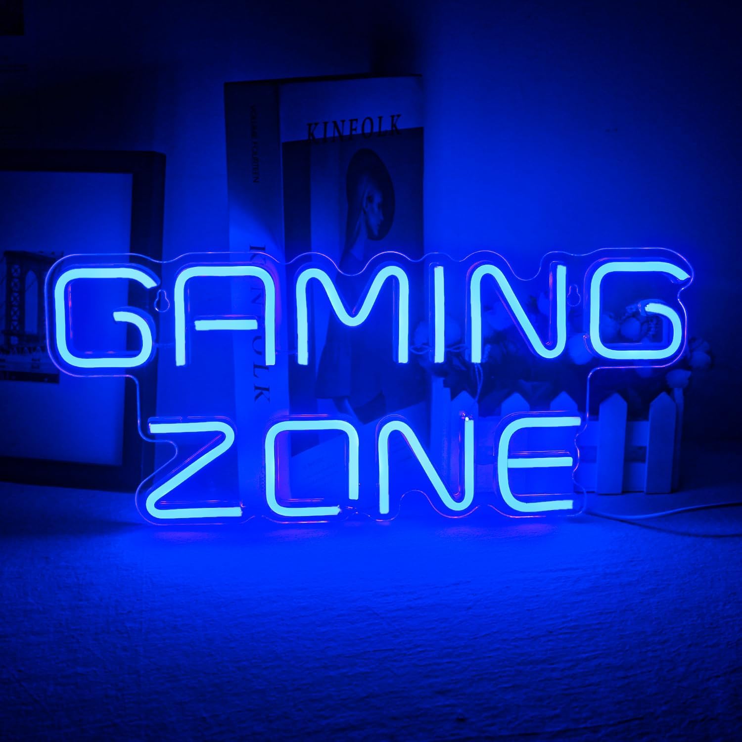 Neon sign with 'Gaming Zone' text in a dark room