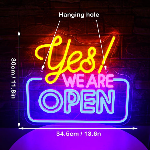 Neon sign with 'Yes! We Are Open' text, dimensions indicated, on a dark background.
