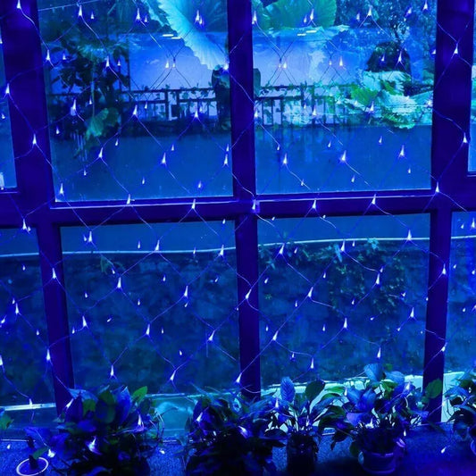 Outdoor fairy lights covering bushes


