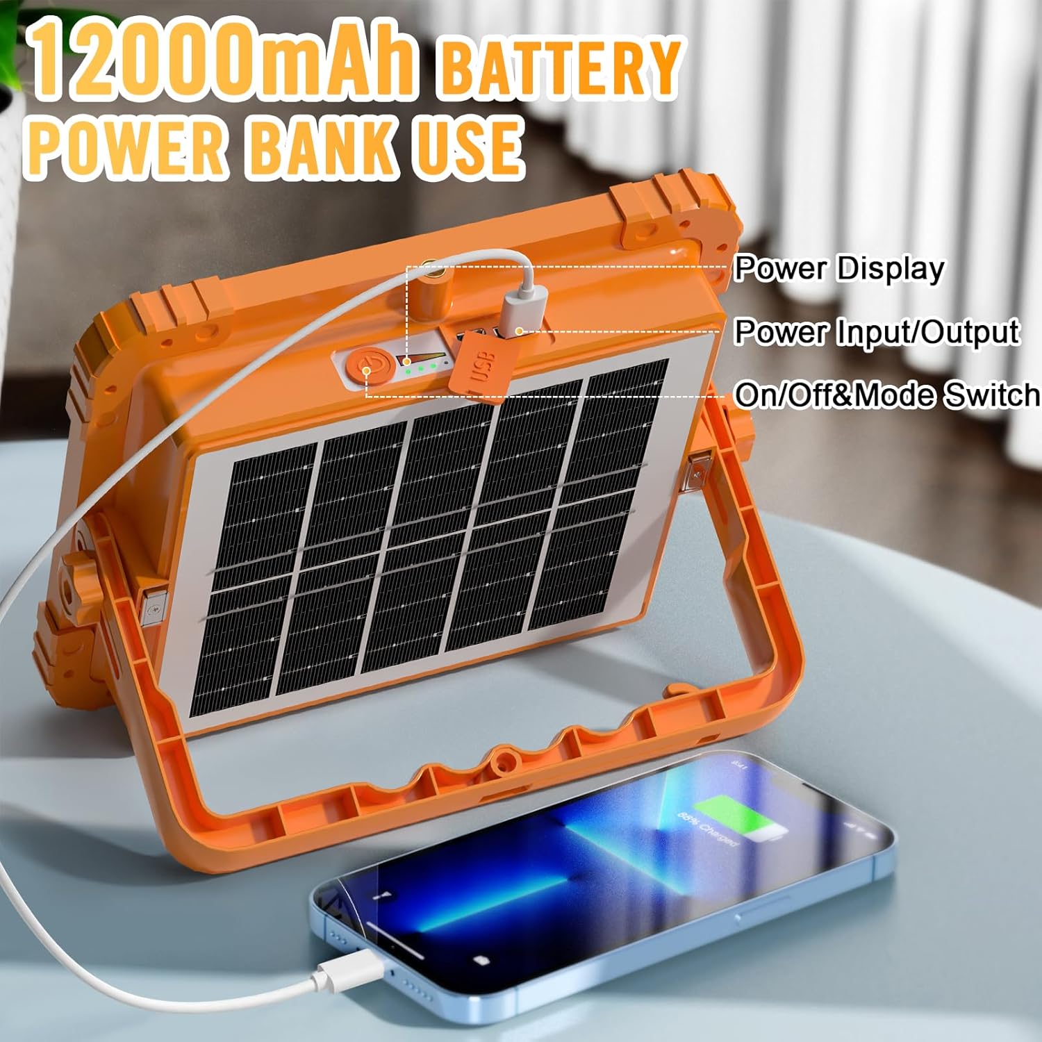 Orange solar power bank with a smartphone being charged, labeled '12000mAh Battery Power Bank Use'.