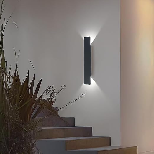 Wall-mounted LED sconce on brick wall

