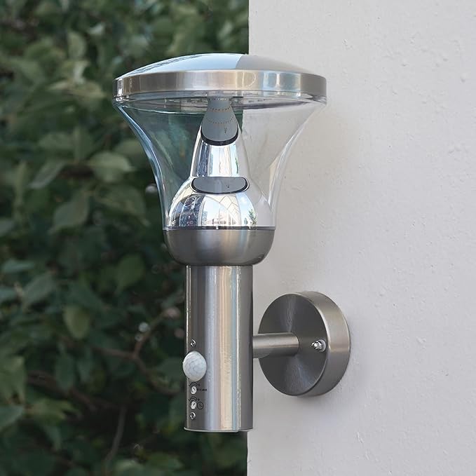 Wall light with 9W warm white LED illuminating patio area


