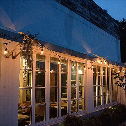 96FT festoon lights with 30 LED bulbs hanging across a garden

