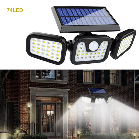 Outdoor 74LED solar motion sensor wall light illuminating a garden path

