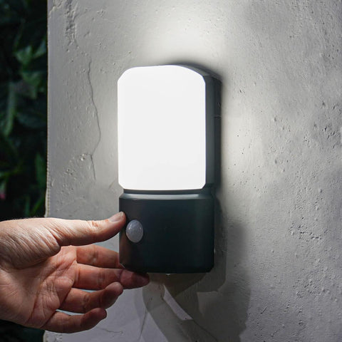 Close-up of the PIR motion sensor on the outdoor wall lamp, improving energy efficiency.

