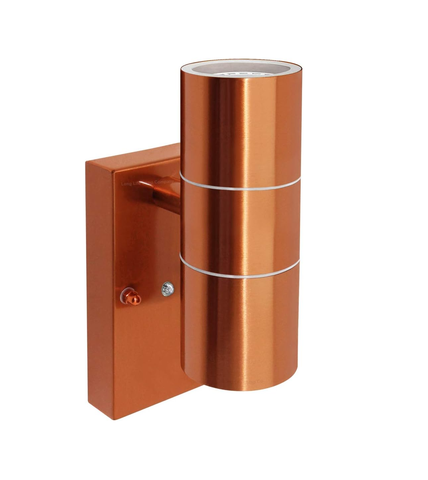 Wall-mounted copper finish outdoor light creating a warm atmosphere

