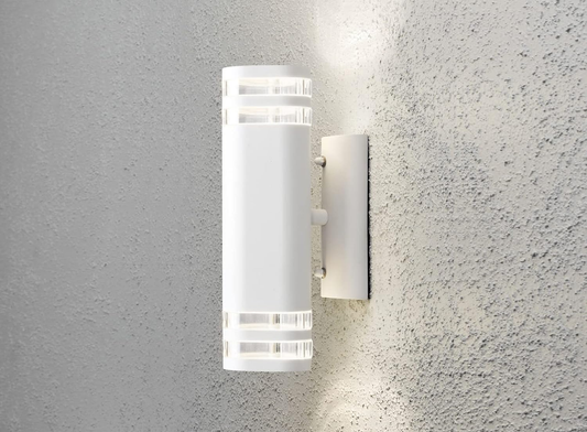Outdoor wall sconce illuminating a porch entrance

