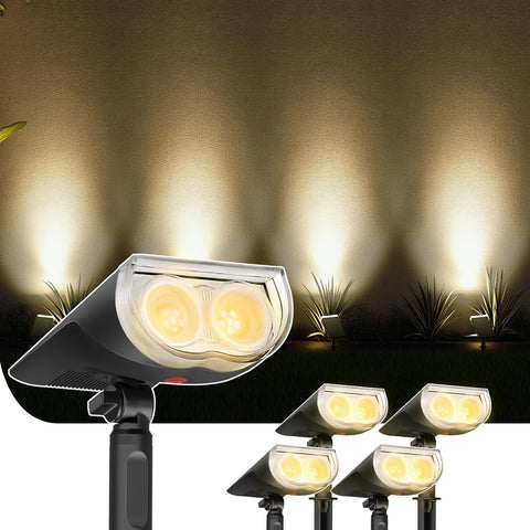 Outdoor floodlights illuminating a garden with plants in the background