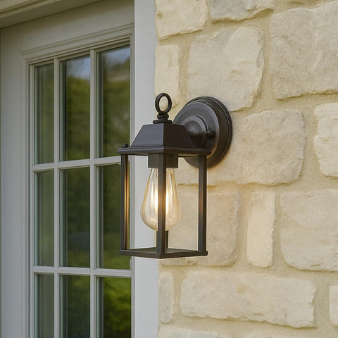 Outdoor wall light fixture on a stone wall next to a window