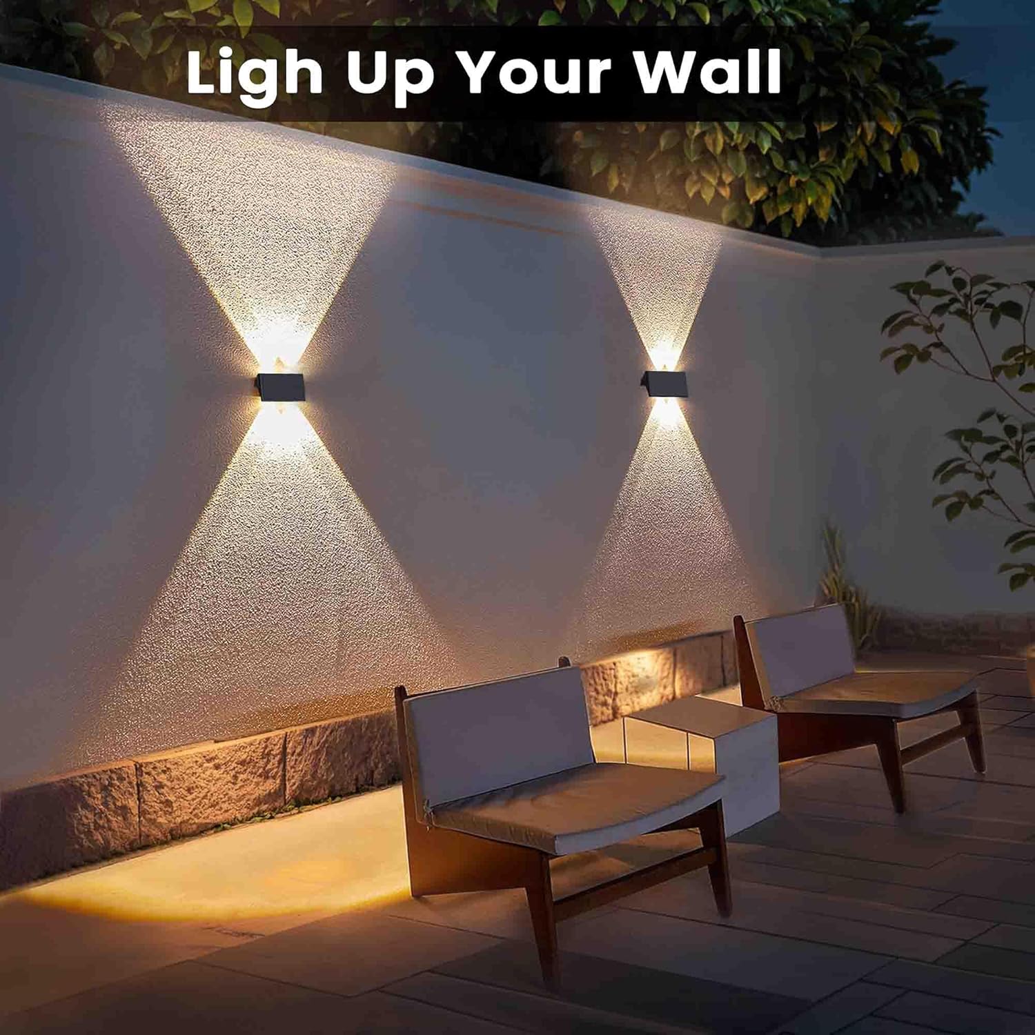 Outdoor wall lights illuminating a patio area with furniture.