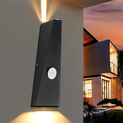 LED wall light showing up and down illumination in garden setting

