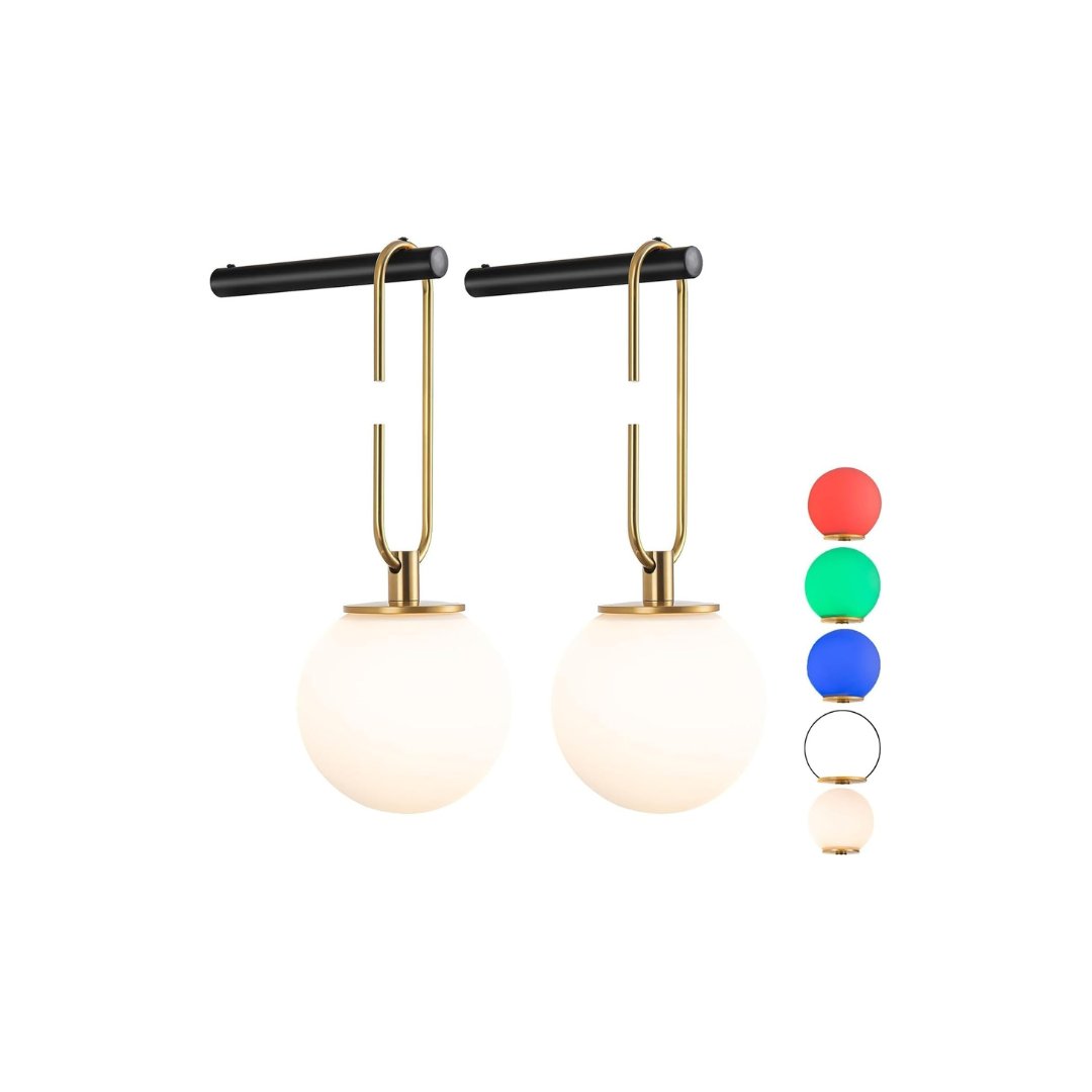 Pair of gold earrings with white spherical ends on a white background
