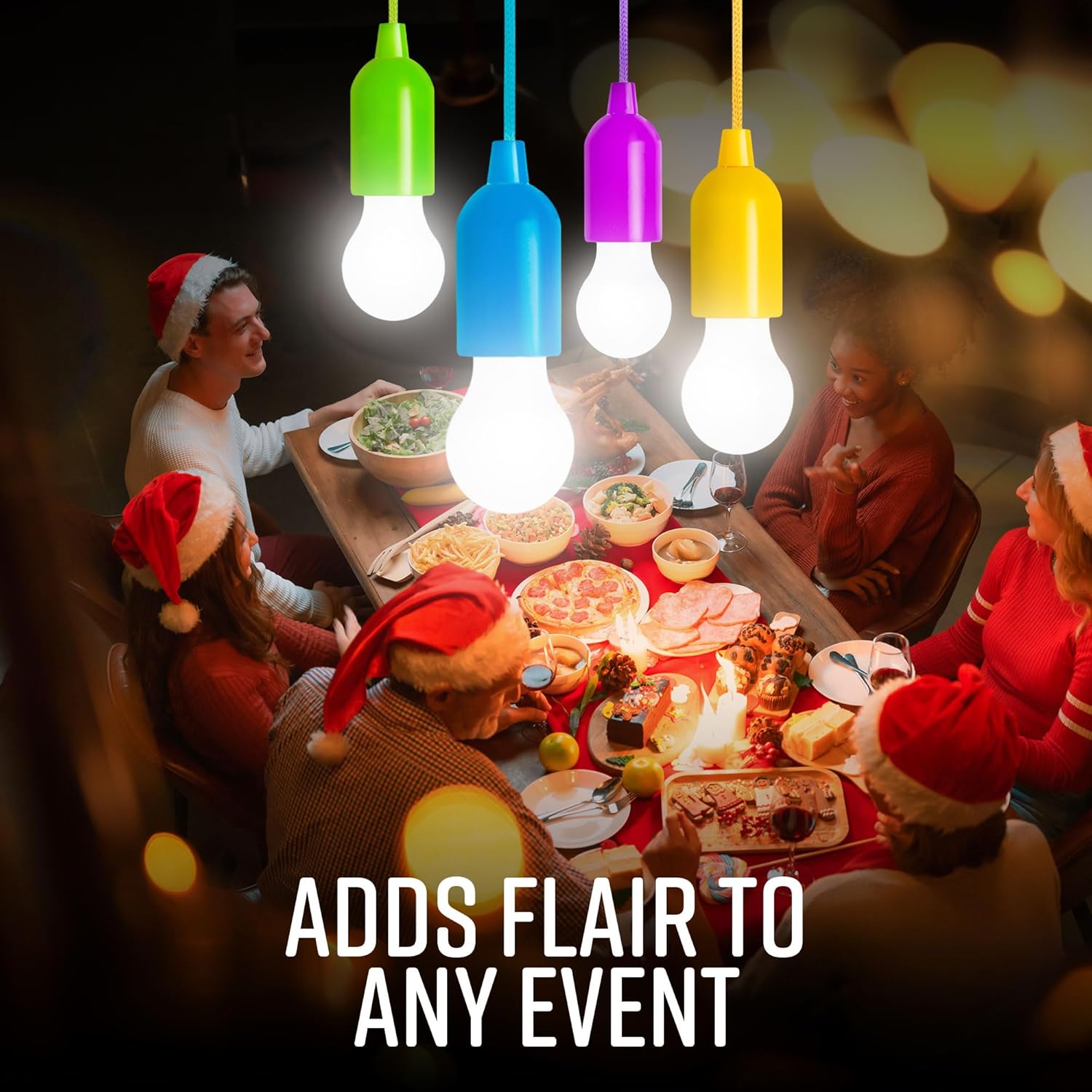 People wearing Santa hats around a festive table with colorful light bulbs hanging above.
