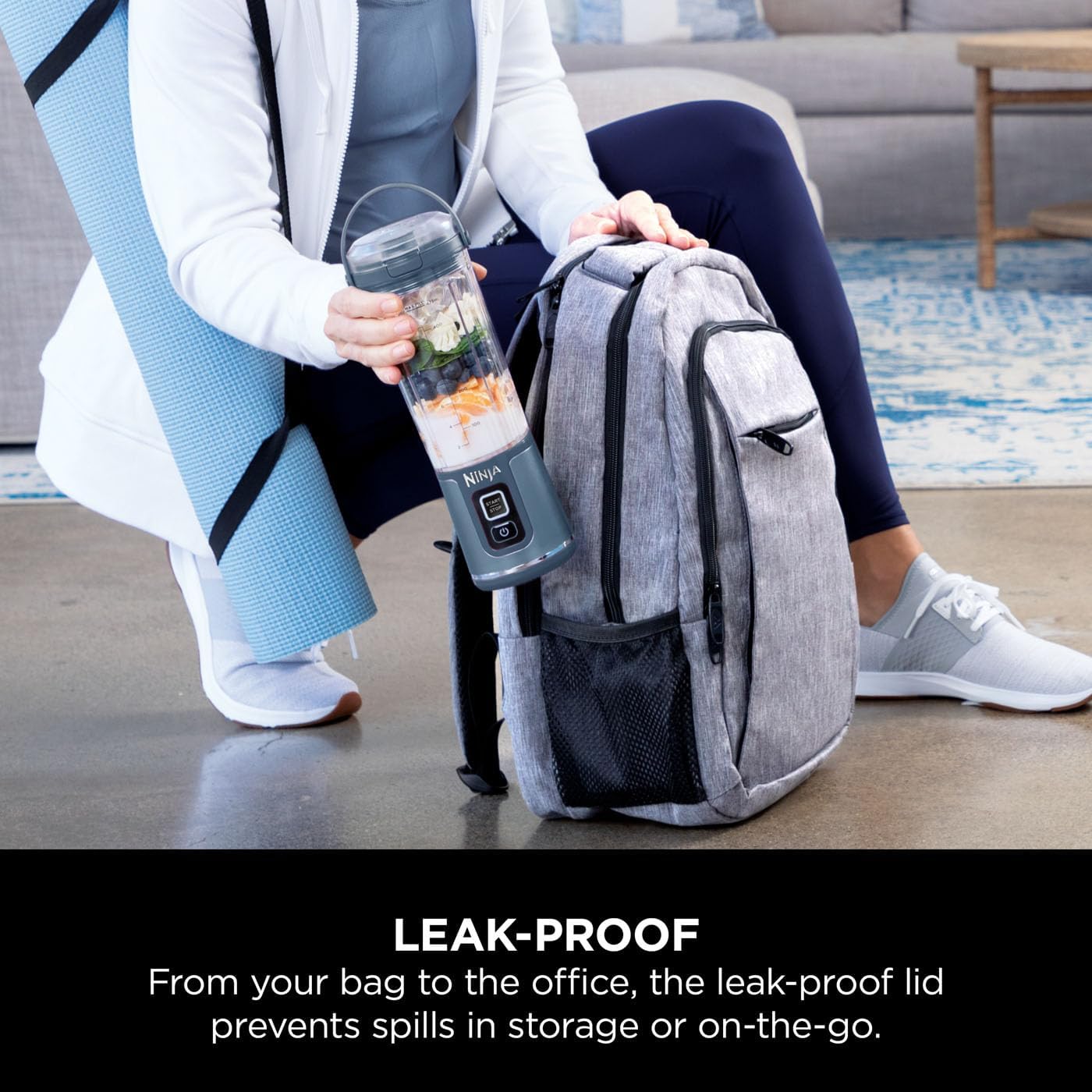 Person holding a blender jar next to a backpack with text about a leak-proof lid.