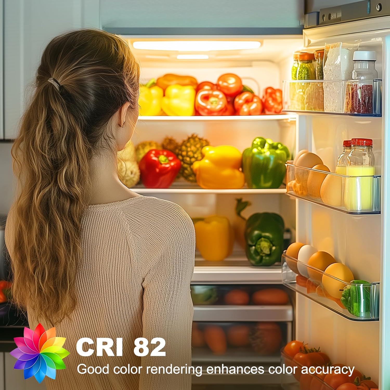 Person looking into a refrigerator filled with various fruits and vegetables, with a CRI 82 label indicating color rendering quality.