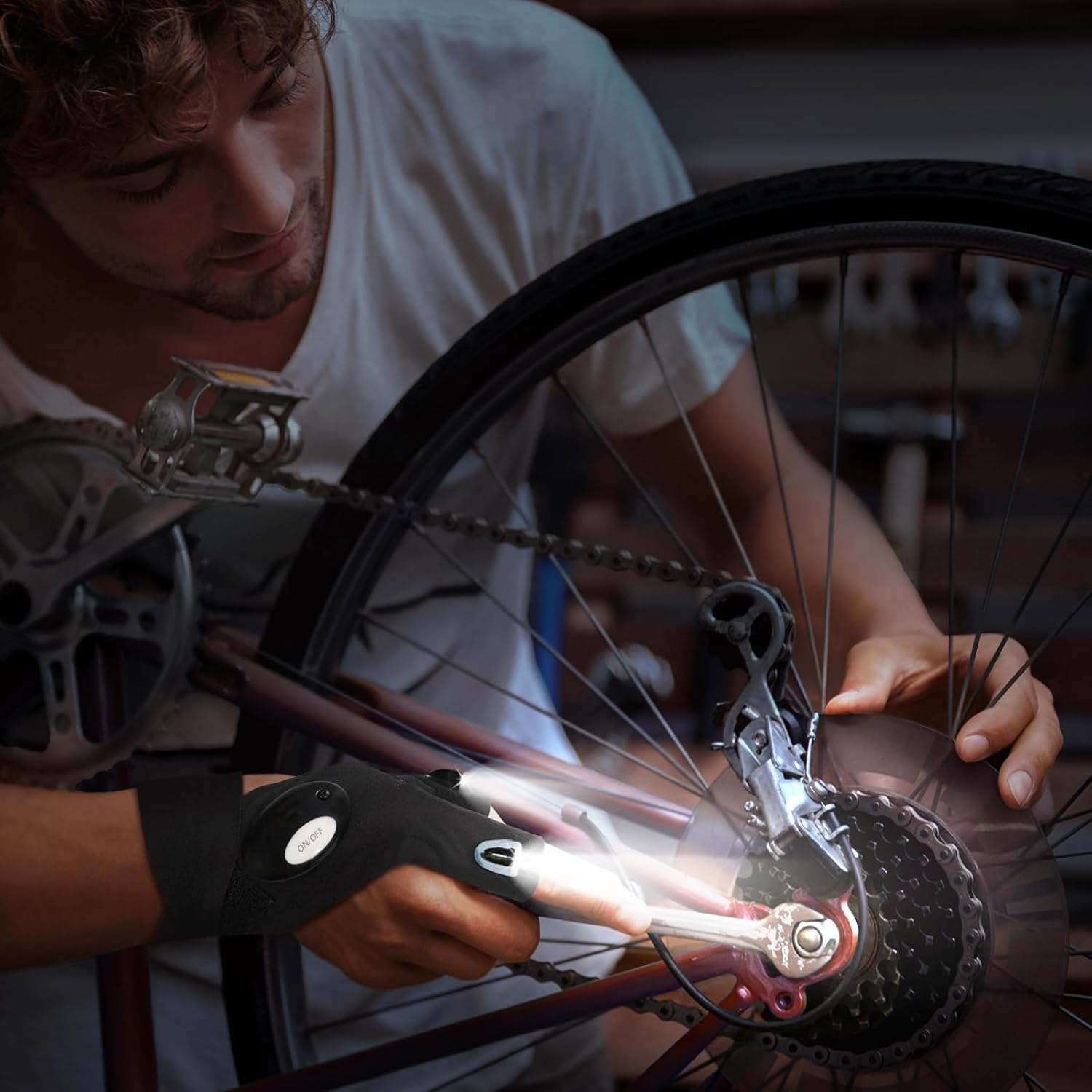 Person working on a bicycle wheel with a close-up of the gear mechanism.