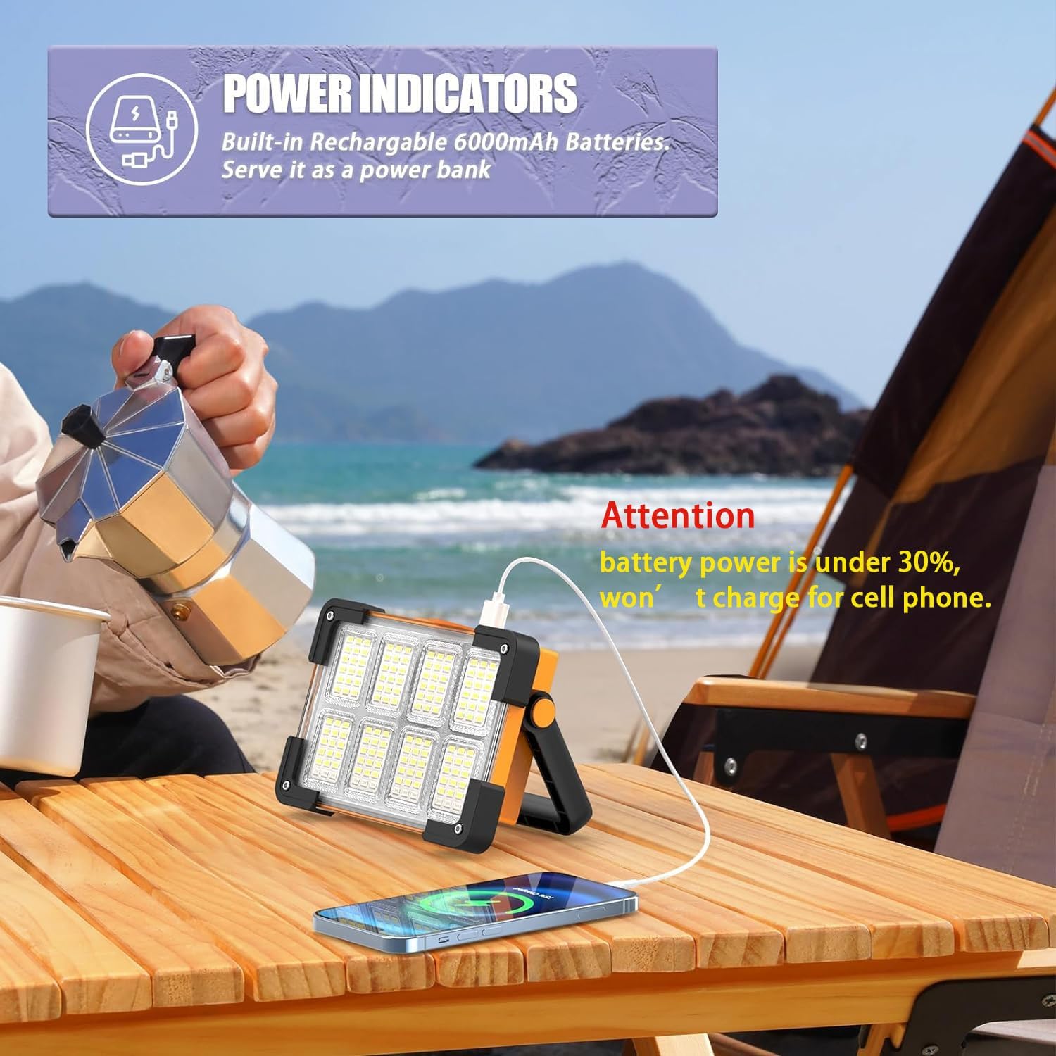 Portable light device charging a phone on a table with a scenic background