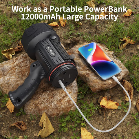 Portable power bank with a phone on a rock outdoors