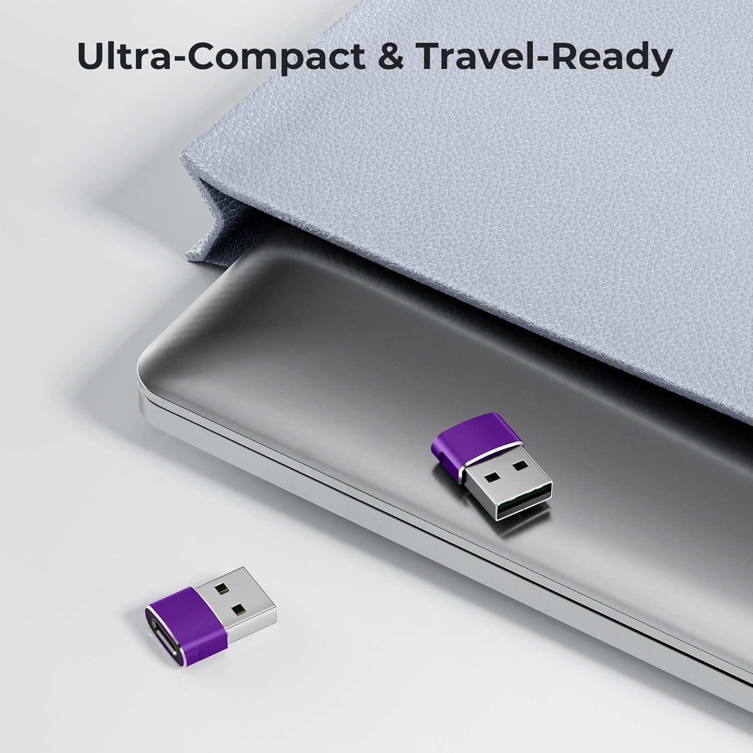Purple USB drive on a metallic surface with text 'Ultra-Compact & Travel-Ready'.