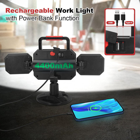 Rechargeable work light with power bank function on a table with a smartphone.