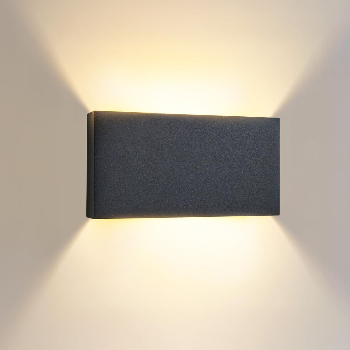 Rectangular wall light fixture on a plain wall