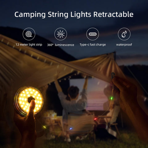 Retractable camping string lights being used at a campsite with a couple watching a movie on a screen.