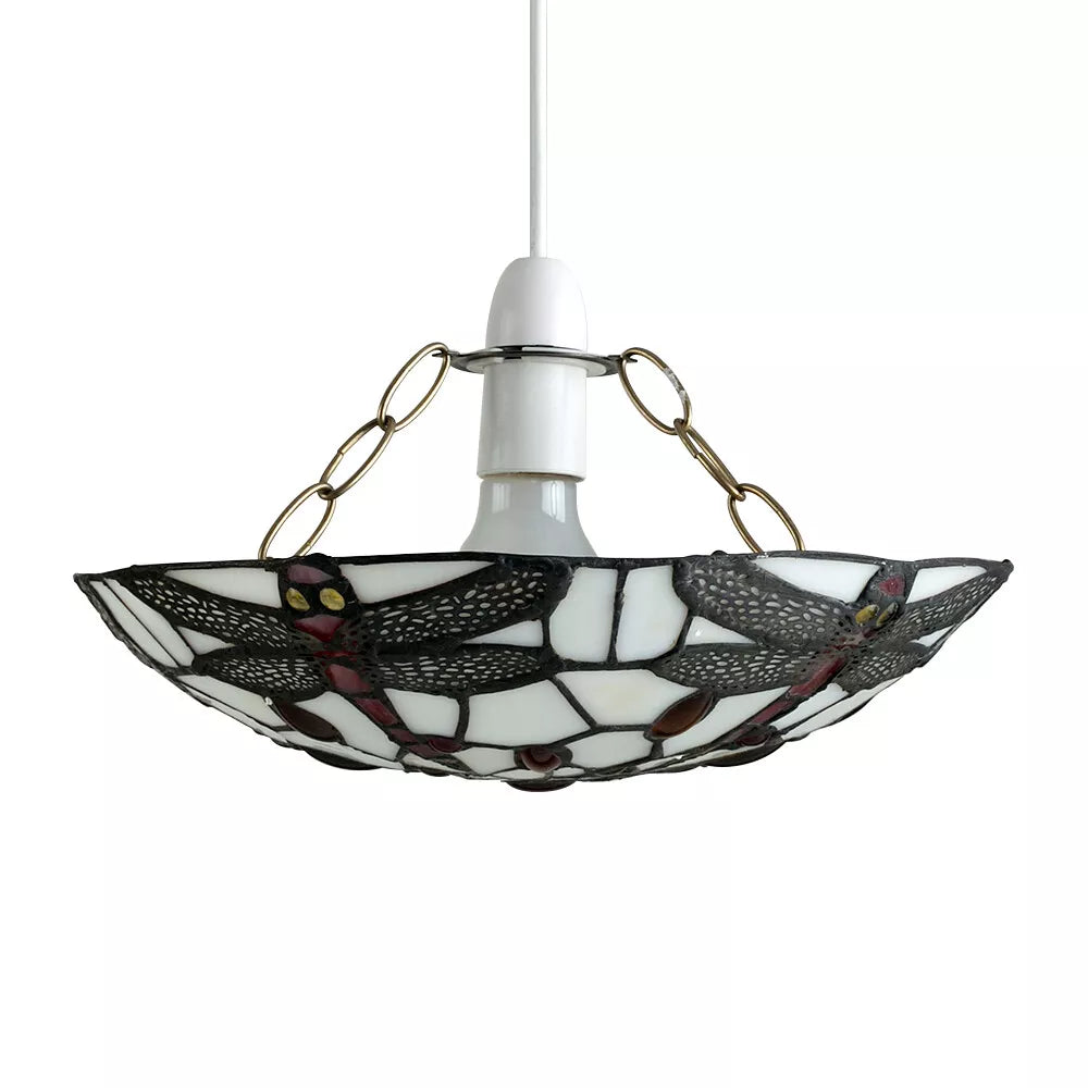 Pendant light glowing above a vintage dining table

