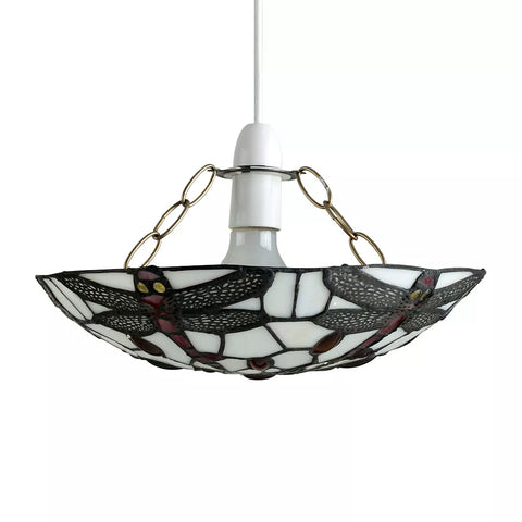 Pendant light glowing above a vintage dining table

